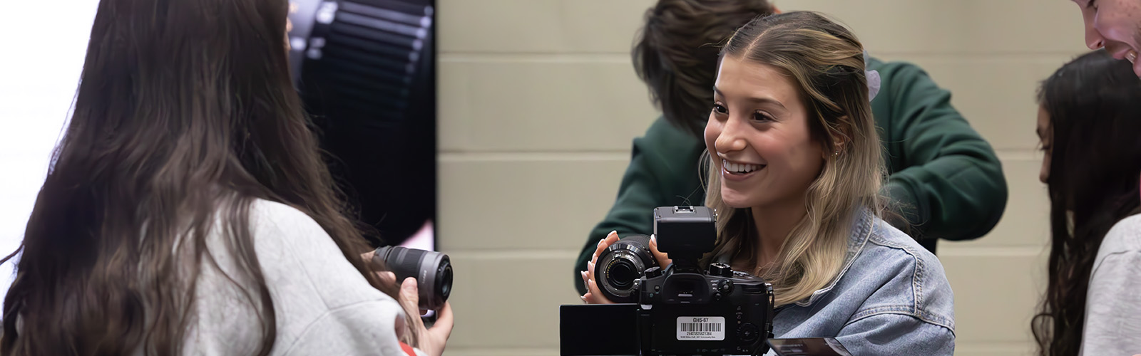 Digital Cinema Production Certificate - Students in CA355 Learning to change camera lenses