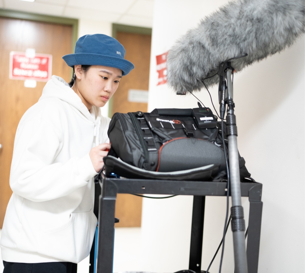 Student using sound recording equipment in CA467